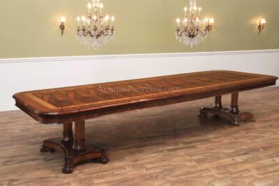 Large exclusive designer dining table with carved apron. Seats 14 persons. Custom designed with double columns for extra stability. American finished table
