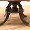 Large round expandable mahogany dining table with matching leaf storage cabinet in our extra dark finish. - Image 13