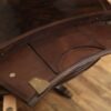 Large round expandable mahogany dining table with matching leaf storage cabinet in our extra dark finish. - Image 7