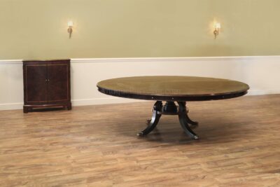 Large round expandable mahogany dining table with matching leaf storage cabinet in our extra dark finish. an AP Exclusive by AntiquePurveyor