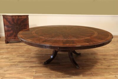 Large round expandable mahogany dining table with matching leaf storage cabinet in our traditional mahogany finish. an AP Exclusive by AntiquePurveyor
