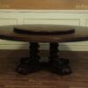 Round rustic dining table with walnut finish and robust base. - Image 7