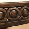 Round rustic dining table with walnut finish and robust base. - Image 3