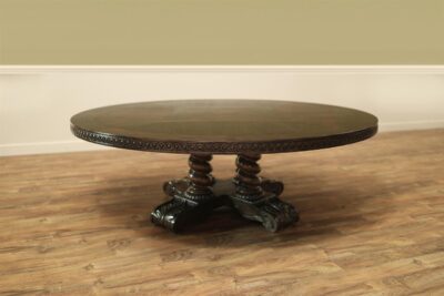 Round rustic dining table with walnut finish and robust base.