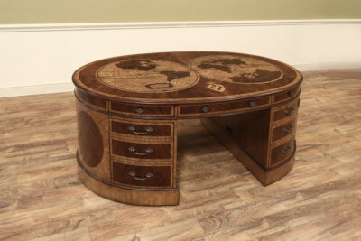 Oval mahogany, walnut and satinwood map desk by Maitland Smith Furniture. Map inlaid pedestal partners desk with generous storage.