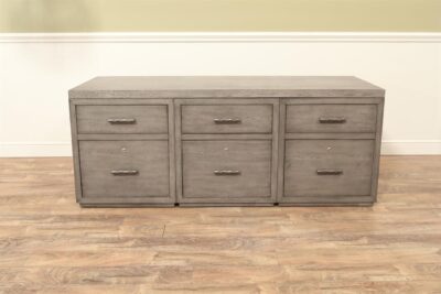 A lightly distressed designer-grade gray oak filing cabinet