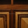 Satinwood, rosewood and other natural materials decorate the door panels