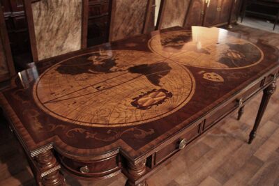 Nautical world map, globe and fleur de lis inlaid mahogany and walnut writing desk
