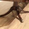 Saber leg pedestals with brass acanthus leaf mounts and foot caps