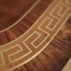 Finely inlaid brass inlays with mahogany cross bandings