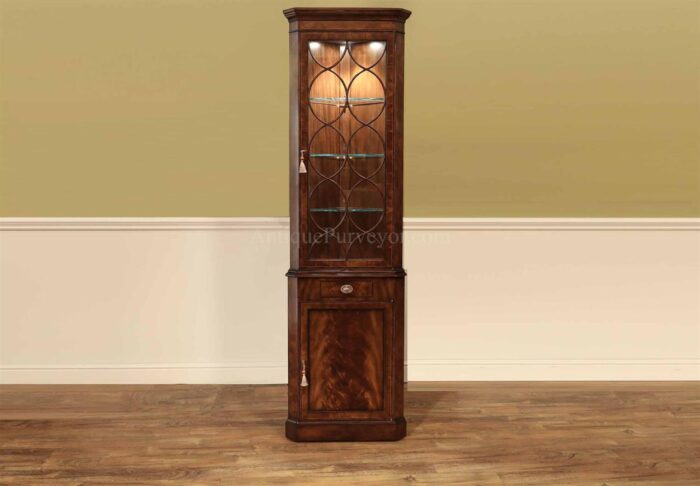 Small narrow mahogany corner cabinet with pin stripe inlays, rosewood border glass doors