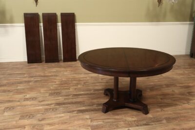 Vintage 54-inch Solid Cherry Pedestal Table with three 15-inch leaves, opens to 99-inches