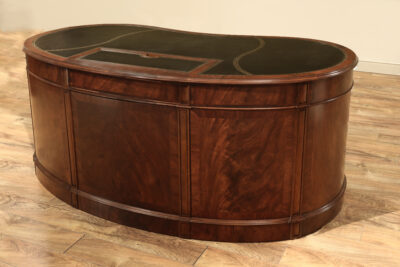 Kidney shaped desk with black leather top