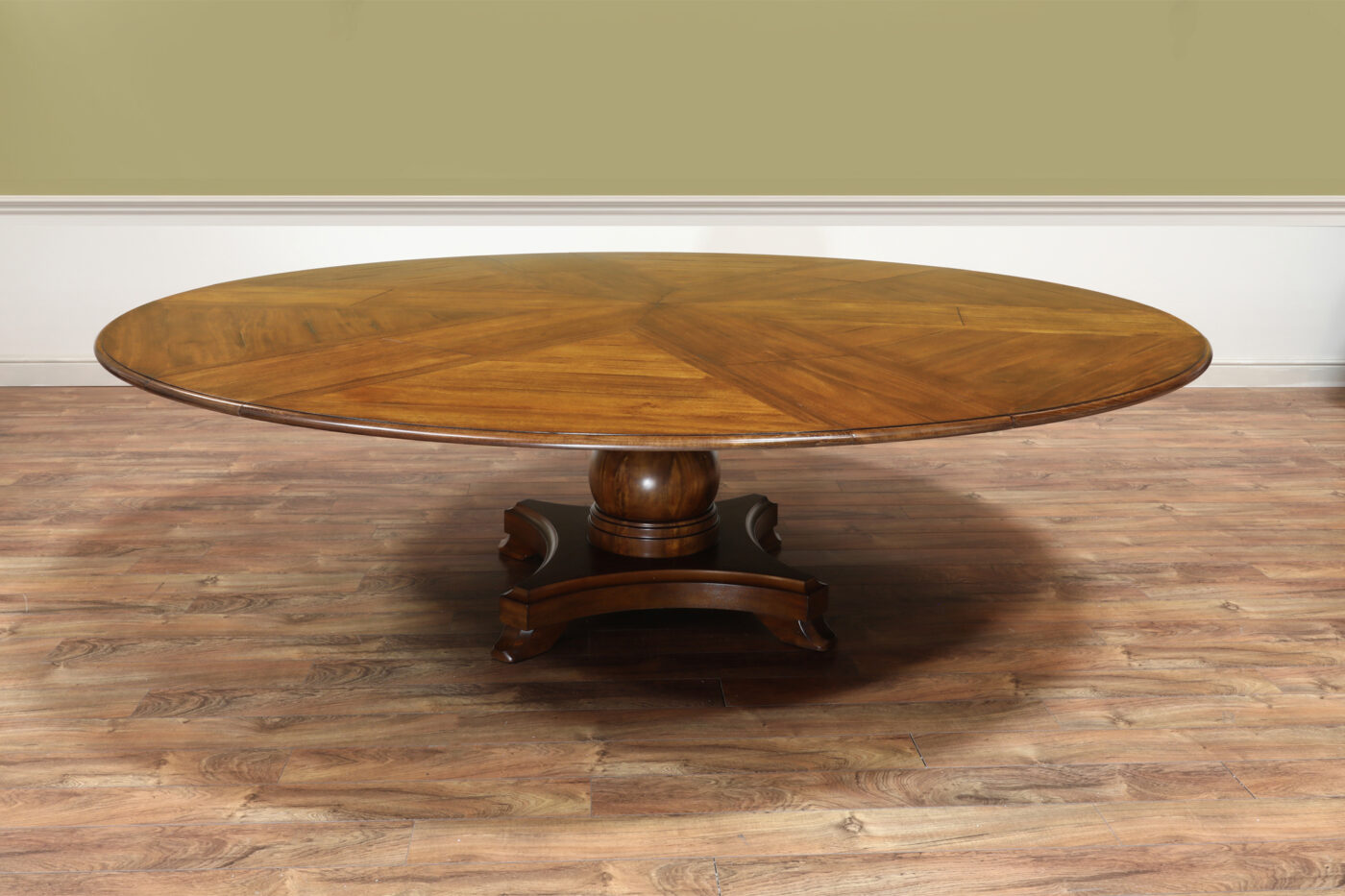 Round expandable Jupe table with self storing leaves