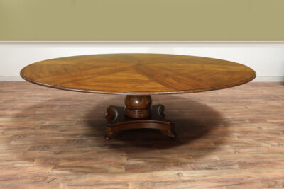 Round expandable Jupe table with self storing leaves